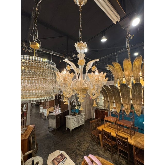 The Murano Gold Venetian Style Chandelier is a luxurious and elegant lighting fixture that adds a touch of sophistication...