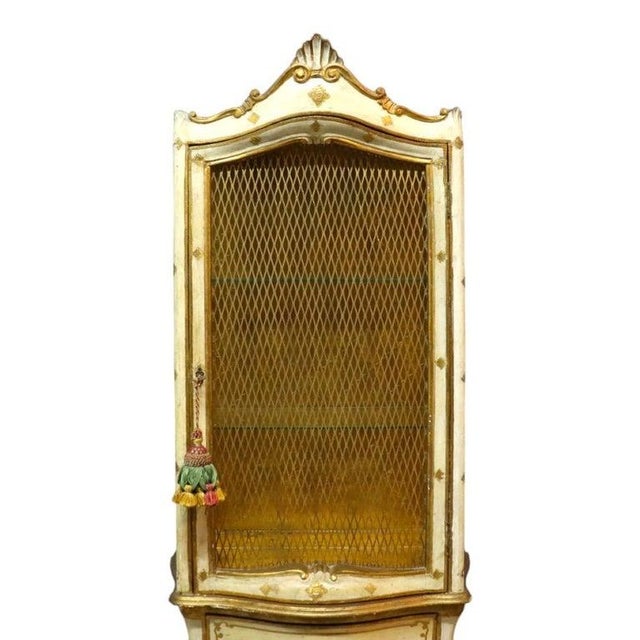 An elegant vintage Italian vitrine by Franco Tacchi, dating to approximately 1960. This piece features an upper display...