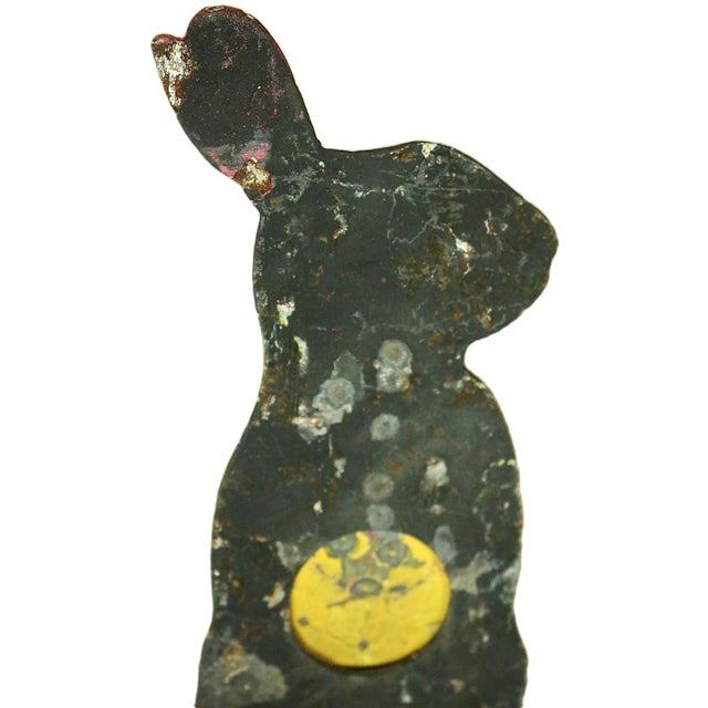 An early 20th century American shooting gallery target in the form of a black rabbit with several coats of old paint. The...
