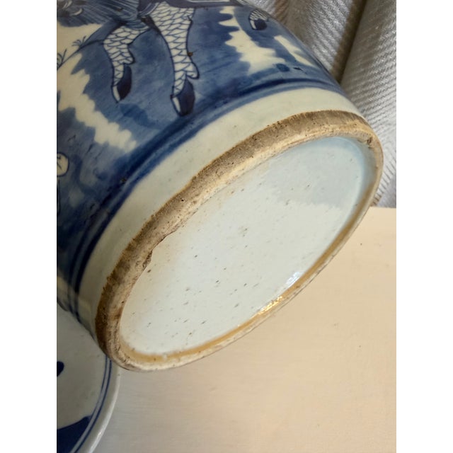 Stunning antique Ming style ginger jar hand painted blue and white with classic Chinoiserie motif.