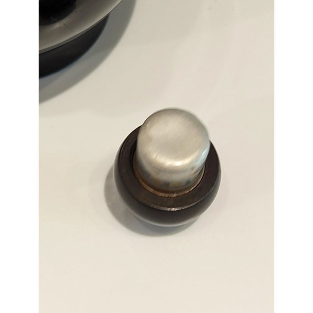 Add a touch of mid-century cool to your space with this "Spherical Miracle" Thermos Water Jug. With its bold, rounded form...