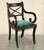 Set of eight English Regency style Ebonised Sabre leg dining chairs with Green velvet upholstery which are part of a large...