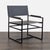 Metal square arm with leather rests. Fixed legs are finished in black. Metal tube frame provides exceptional structural...
