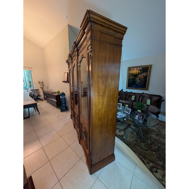 Offered is a stately, commercial-grade vintage china cabinet/display case custom-manufactured by the renowned John...