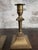 Pair of Victorian brass candlesticks, circa 1860s. Baluster-turned stem on a square, stepped, beaded base, with a campana-...