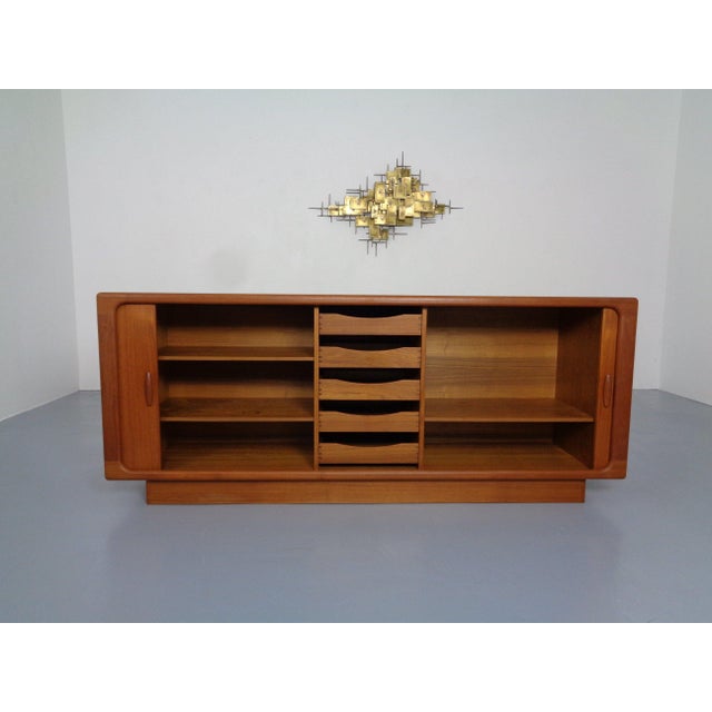 Sideboard by Dyrlund in teak. Very nice, ready-to-use condition. This piece has an attribution mark, I am sure that it is...