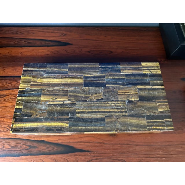 Decorative jewelry box in tessellated exotic tigers eye with velvet interior.
