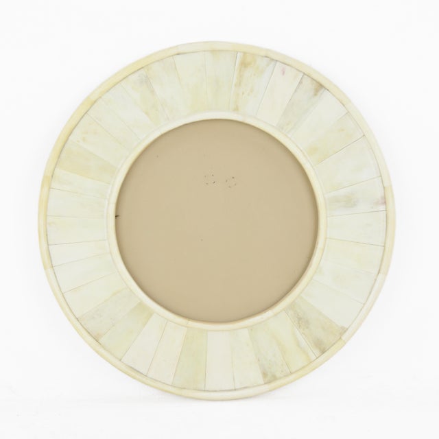 Elevate your cherished memories with this exquisite vintage round photo frame, featuring a stunning bone-inlay design in...