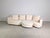 Beautiful three-piece Rolf Benz design corner sofa, including an ottoman. The sofa is upholstered in high-quality light-...