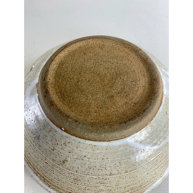 This is a mid-century vintage studio pottery artisan decorative bowl. This large bowl has beautiful sculpted handles on...