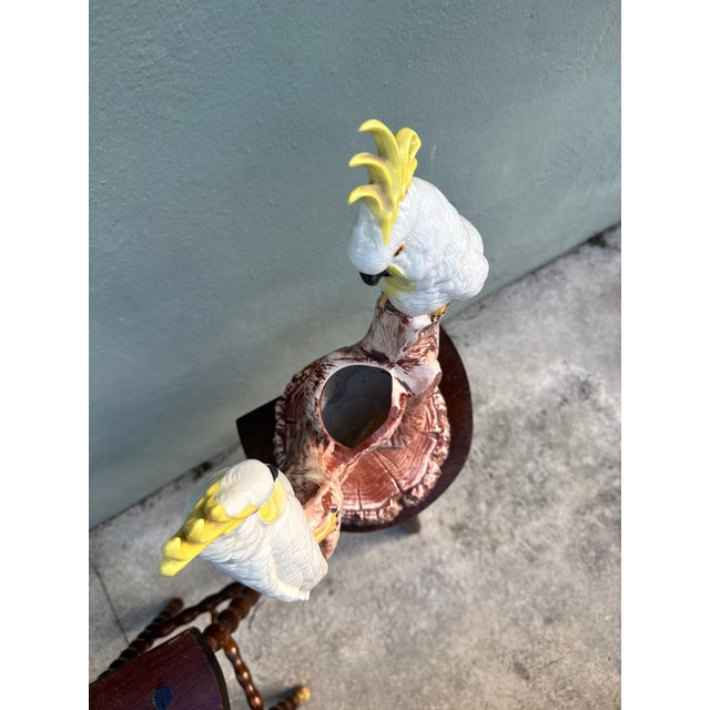 This charming vintage Italian Majolica ceramic cockatoo planter, perched gracefully on a floral tree stump, embodies the...