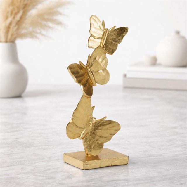 Add a touch of glam nature-inspired style to your home with this Gold Stacked Butterfly Décor set. Featuring beautifully...