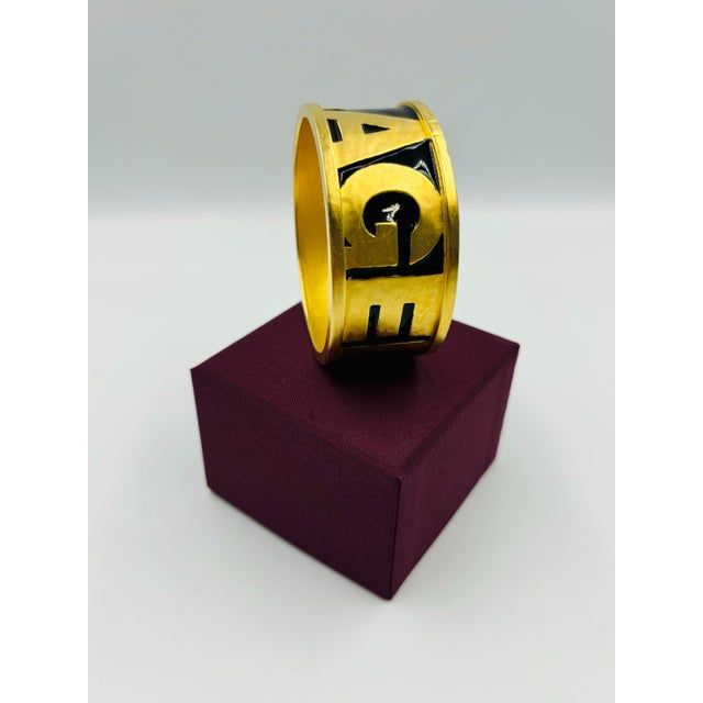 Oh La La! Bon Jour Karl! Feast your eyes on this lavish 90s "Lagerfeld" runway cuff-style bangle. Rare and iconic piece...