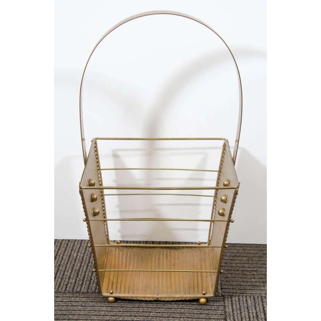 Italian Mid-Century Modern 1950s brass magazine basket. Original condition. Basket measures 11 3/8" wide x 10 1/4" deep...