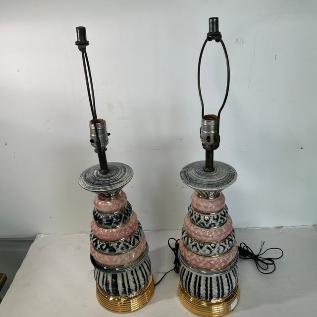 Adorable pair of 1950s lamps. Very nice bright glazed design. Would look great in any interior looking to add a vintage vibe.