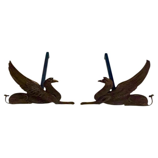 19th-Century Bronze and Wrought Iron Andirons Featuring Griffins An impressive pair of antique andirons depicting...