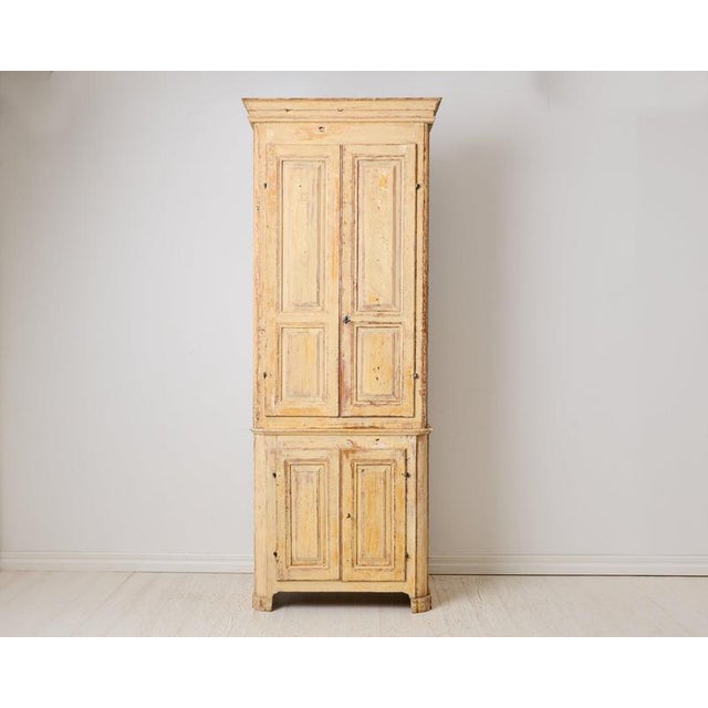 Antique tall narrow cabinet from the early 1800s. Made around 1810 to 1820 in northern Sweden. The frame is made by hand...