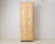 Antique tall narrow cabinet from the early 1800s. Made around 1810 to 1820 in northern Sweden. The frame is made by hand...