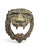 Striking 19th-century bronze sculpture depicting a lion's head, masterfully rendered with exceptional attention to detail....