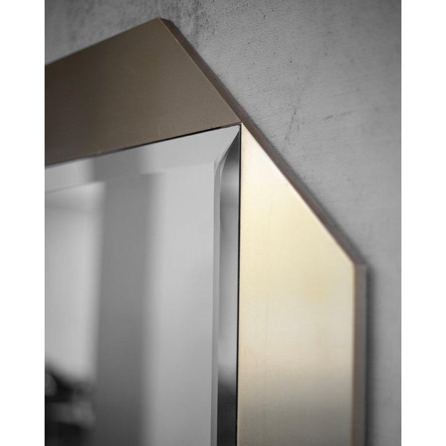 The octagon-shaped mirror comes from Italy. It has a frame made of brushed brass (which is less golden than traditional...