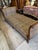 Beautiful early 20th century (1910-1920) French hand-carved walnut daybed with new faux leopard upholstery. Bed includes a...