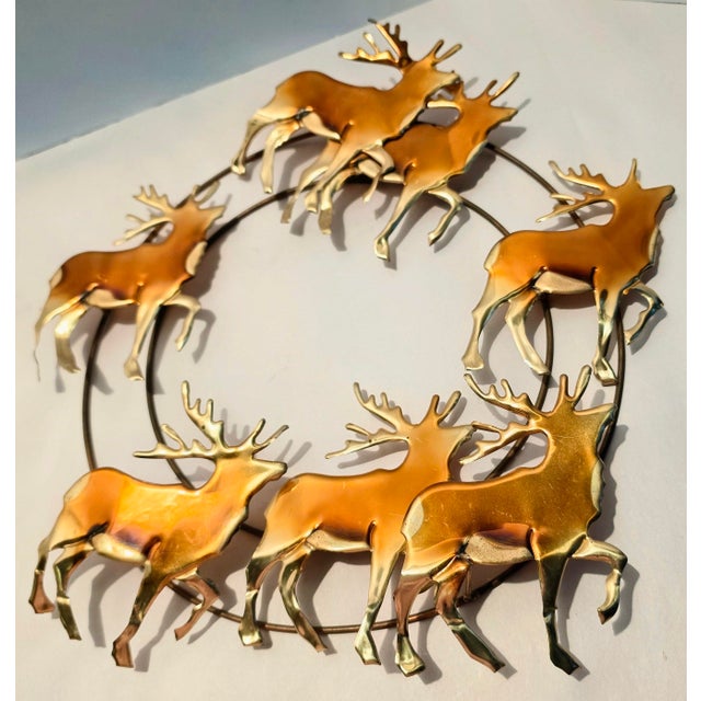 This vintage brass and copper Reindeer wreath is made of torch cut figures in a mid-century modern style. The wreath has...