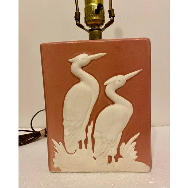 This vintage lamp has an old Florida boho vibe. I love the striking contrast of the matte white birds against the pinky...