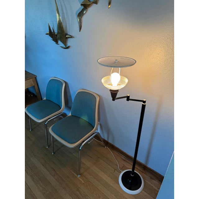 This floor lamp dates to the late 1960s, a period when lighting design began to push beyond straightforward utility and...