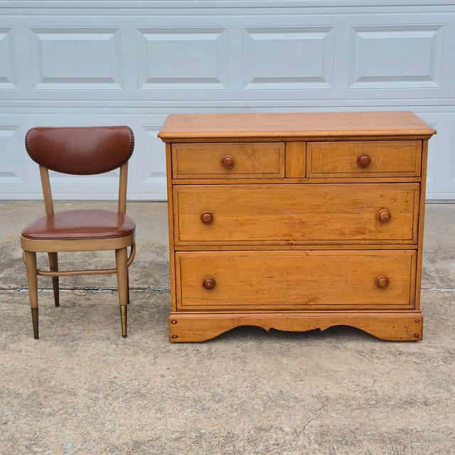 This is a nice old maple chest of drawers that is unsigned but likely made in the United States in the early 20th century....