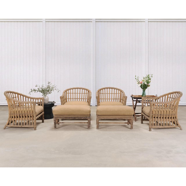 A stylish weathered set of eight mid-20th century patio and garden armchairs and ottomans designed by Danny Ho Fong for...
