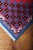 Colorful rug in red and blue colors. The rug is hand-knotted from soft wool. Higher pile on cotton warp. Central...