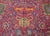 A wonderful and whimsical early 20th century Indian Agra rug with an all-over pattern of large-scale flowers and scrolling...