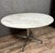 According to Herman Miller, Charles and Ray Eames: Magnificent dining table circa 1970 with a circular Carrara marble top...