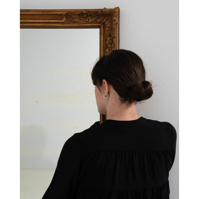 A mirror whose ornate gold gilt carved frame, tall gives it real character at first glance. It was made in France during...