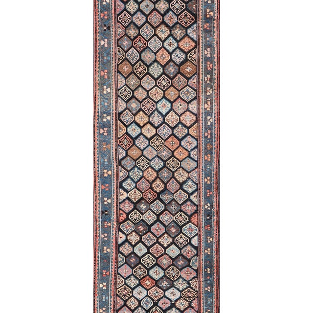 Measures: 3'5 x 18'8 Antique Hand Knotted Hamadan Runner with All-Over Tribal Design in Jewel Tones. Keivan Woven Arts /...