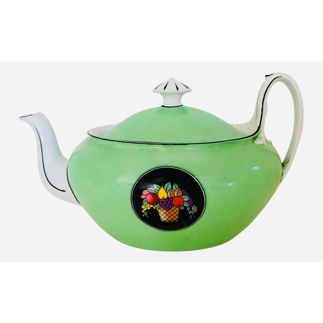 Art deco (1920-1930s) 3-piece porcelain tea set with teapot, sugar bowl, creamer and lids in jade green and decorated with...