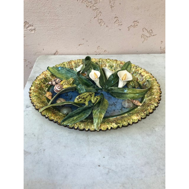 Rare majolica platter arums, frogs, shells signed Christine Viennet circa 2000. Christine Viennet studied at the Oslo...