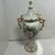 This decorative porcelain urn was produced by Lenwile-Ardalt, a company known for creating fine porcelain and ceramic...
