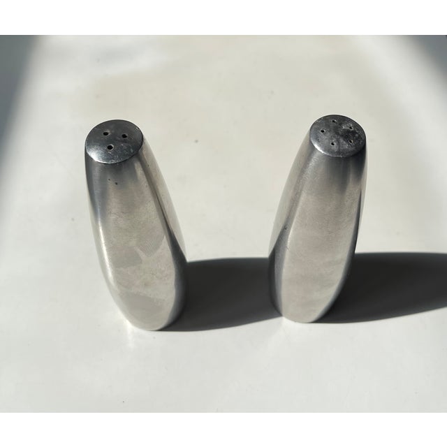 Stylish torpedo shaped salt and pepper shakers in stainless steel. Designed by IHQ - Jens Harald Quistgaard for his own...