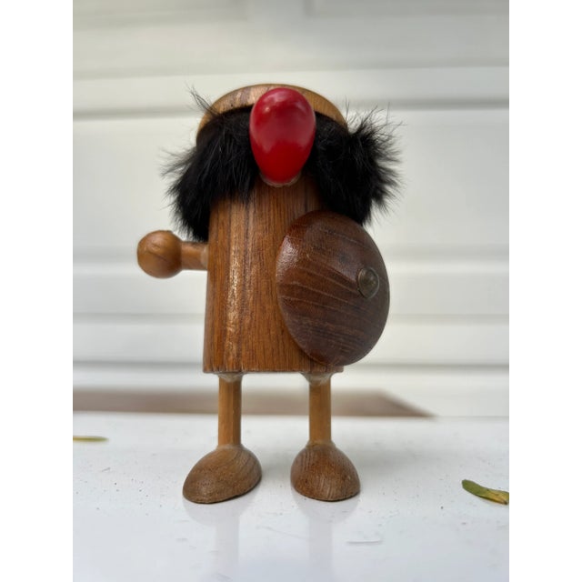 A fun vintage Viking figurine ready for battle with his shield raised. He’s missing his weapon and his signature helmet...