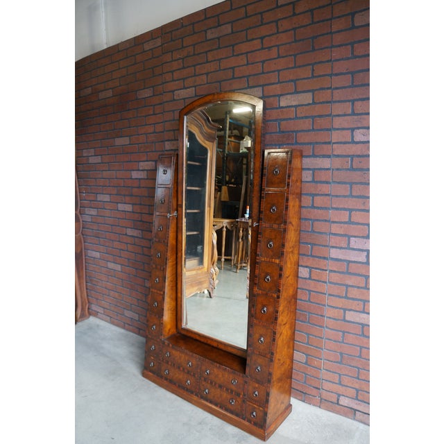 Unique, stylish and functional all describe this "Celebrity" Cheval Mirror by Theodore Alexander. Featuring 22 drawers...