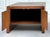 A distinctive vintage mid-century modern cabinet-style side table in the style of Harry Lunstead, featuring a substantial...