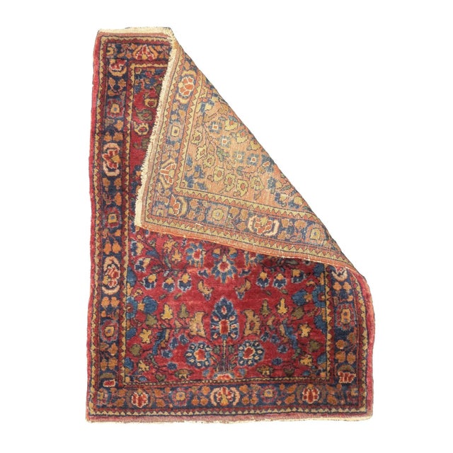 The well-woven village carpets from the Arak/Sultanabad area, especially the red field/navy border, detached floral spray...