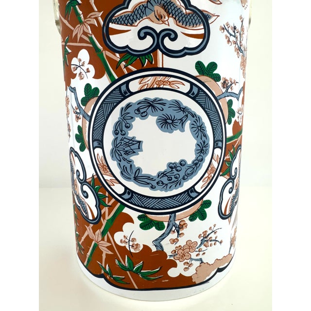 Mid-century lidded ice bucket designed by Georges Briard, featuring a vibrant chinoiserie-inspired motif with birds,...