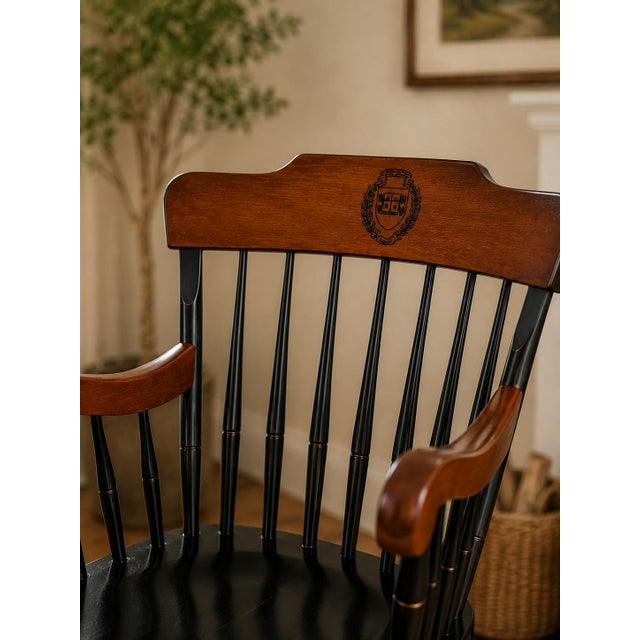 A beautifully crafted mid-century Windsor-style armchair featuring the distinguished Yale University "Lux et Veritas"...
