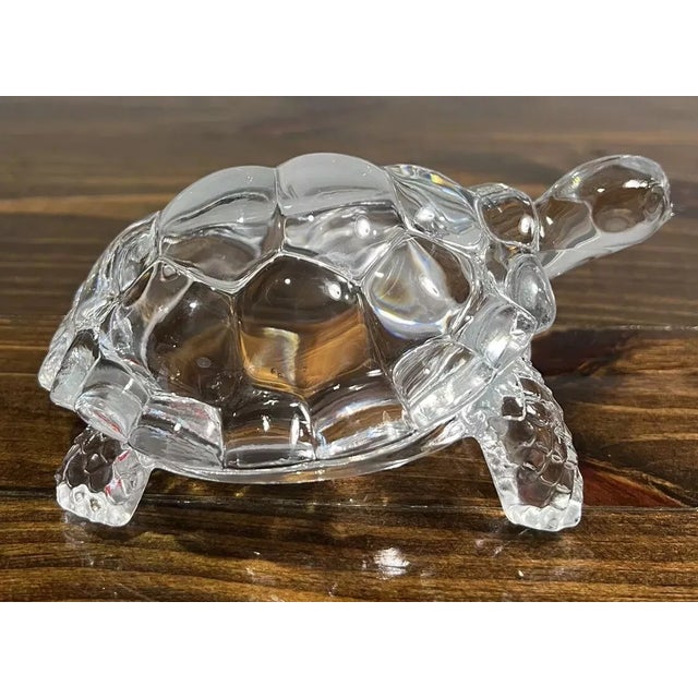 An elegant crystal glass turtle figurine. Finely crafted with precision from crystal, the tortoise symbolizes wisdom,...