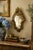 An Italian Rococo–style giltwood wall mirror, richly carved with scrolling acanthus and shell motifs that give the piece...