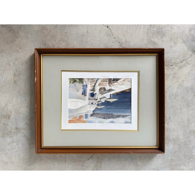 This charming Modern - Vintage watercolor painting captures the timeless beauty of Santorini, Greece, with its iconic...
