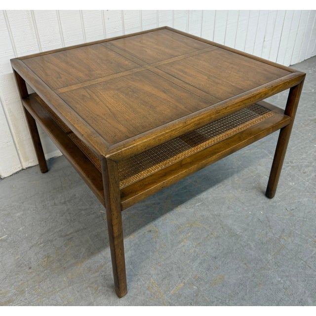 This handsome 1970’s Baker Furniture coffee table exemplifies timeless American craftsmanship with refined mid-century...