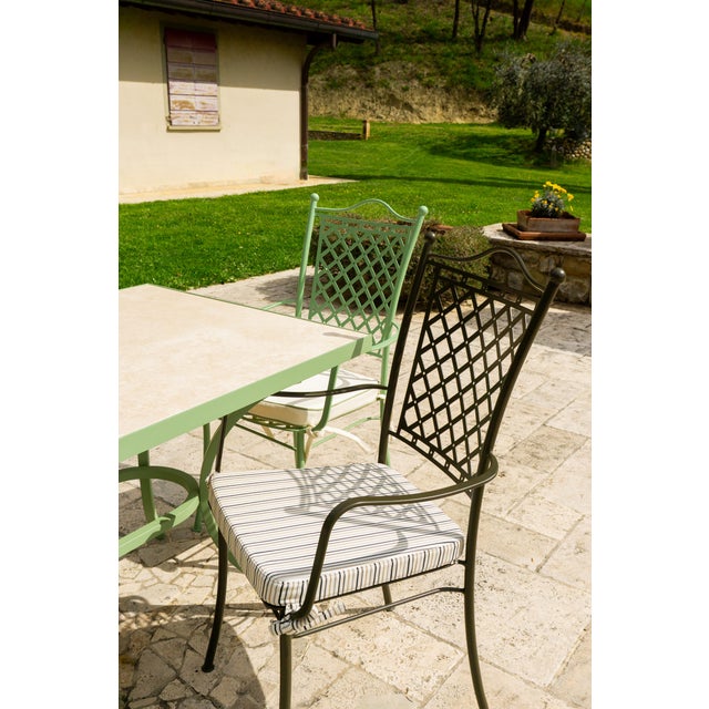 Shedir is a metal outdoor chair crafted in Italy in the tradition of wrought iron, reinterpreted with a contemporary...